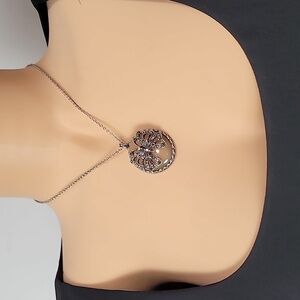 Marquisite Butterfly over light pink stone, set in silver.